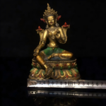 Green Tara wears a soft smile and radiates compassion