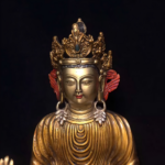 A highly intricately carved sandalwood Buddha figure