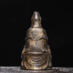 Well-carved gilt bronze child-bestowing Kwan-yin statue