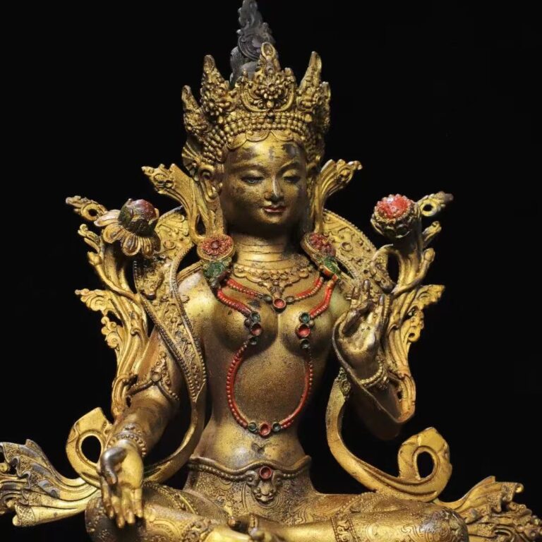 Close-up photo of Green Tara statue