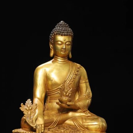 Right hand holding Haritaki medicinal branch, Left hand holding nectar vase