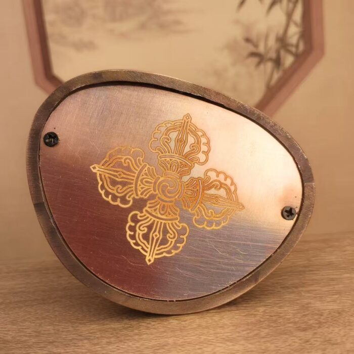Sacred cross vajra maked and sealed on the bottom of the sculpture