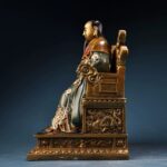 Seated Zhenwu statue bears solemn countenance with righteous aura to suppress negative energy
