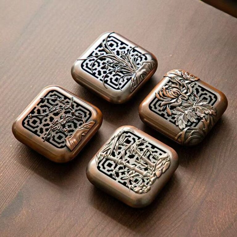 Four square bronze-tone censers engraved with plum, orchid, bamboo and chrysanthemum motifs